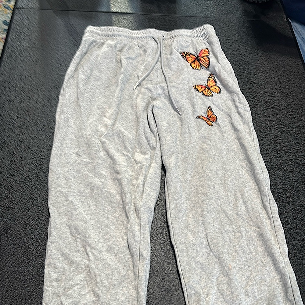Gray baggy sweatpants with butterfly design